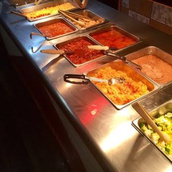 The Vallarta buffet line — steam trays of rice, beans and guisados